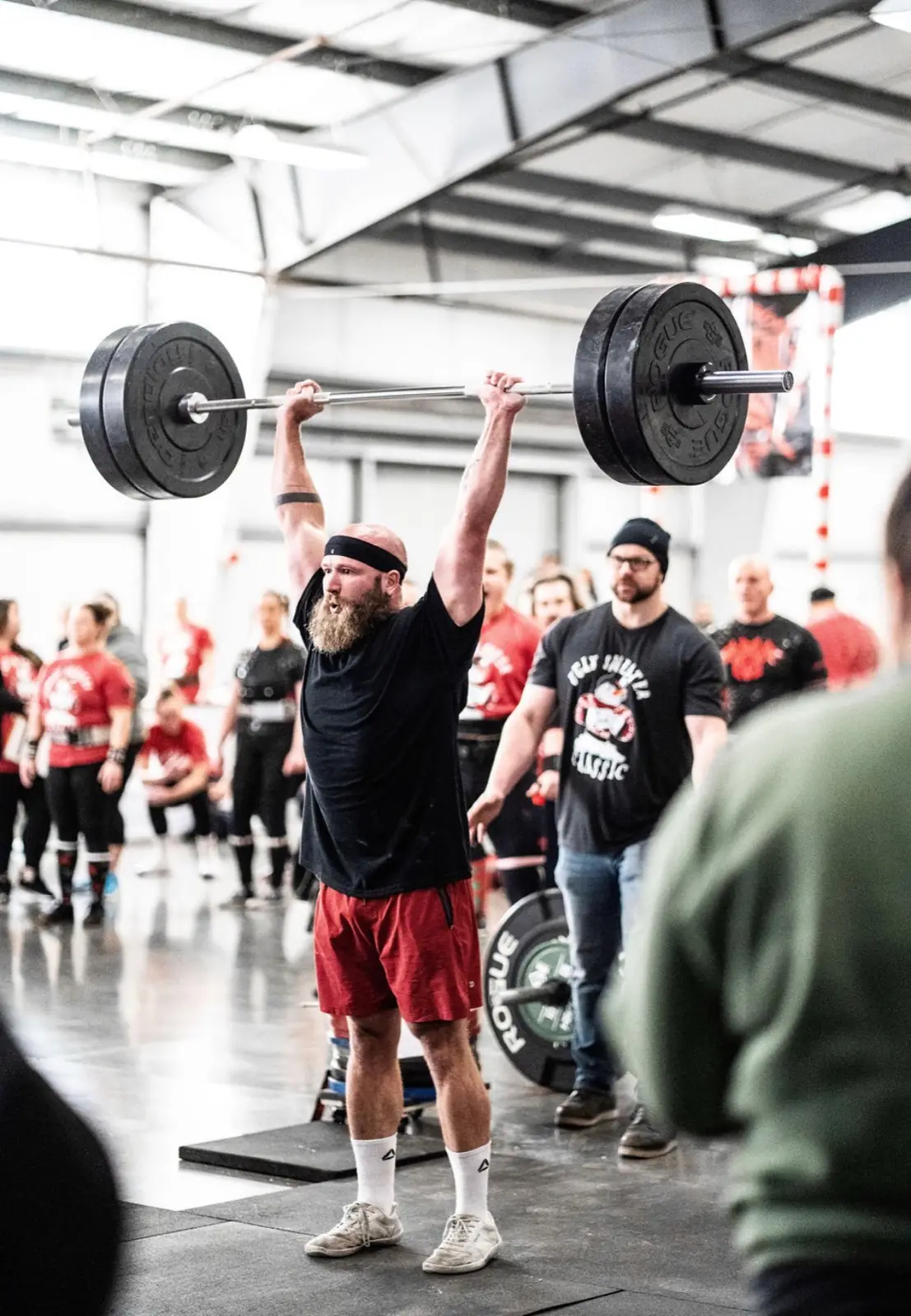 Powerlifter completing a lift at a strength event