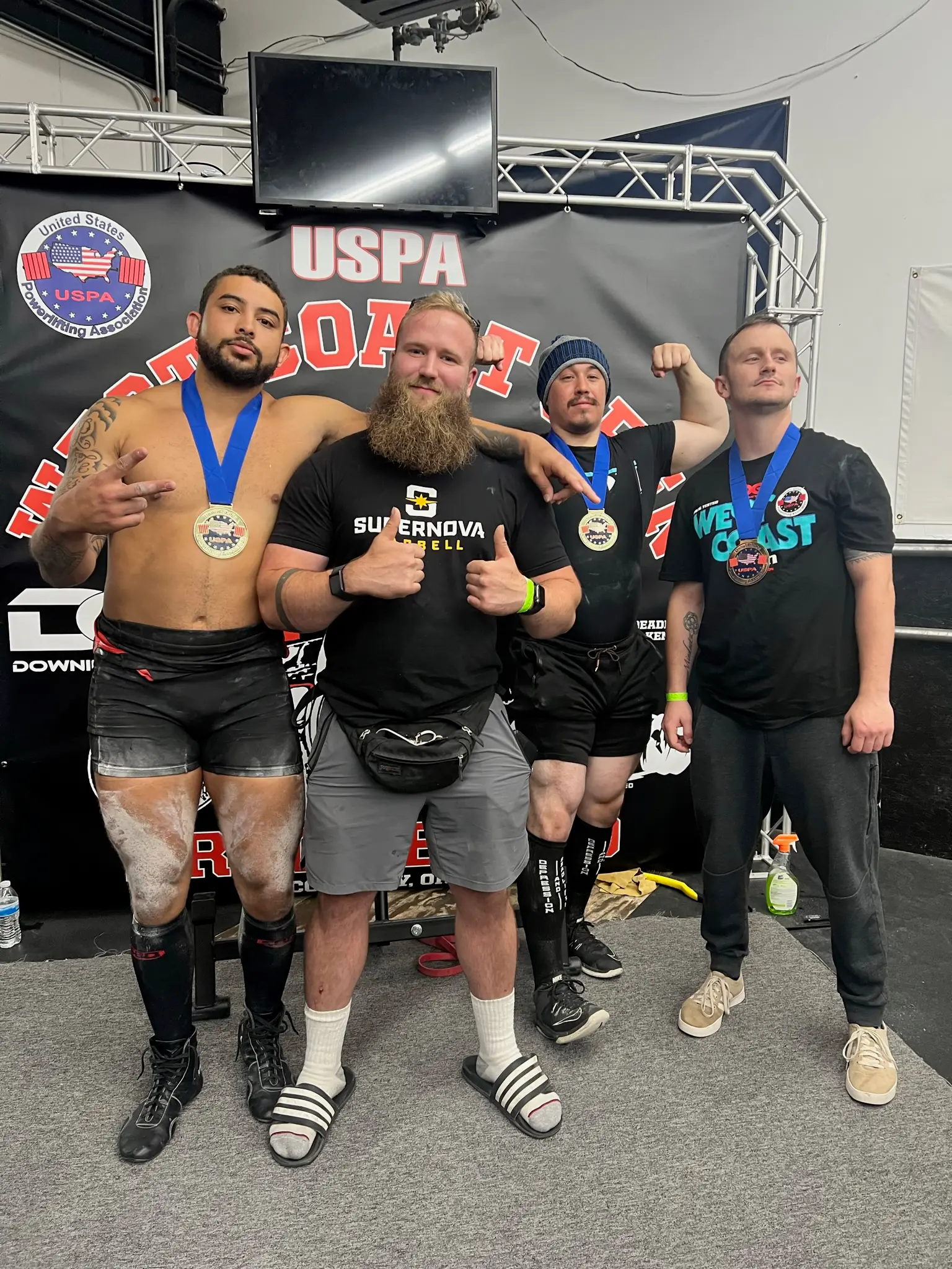 GorillaDiesel athletes wearing their meet medals