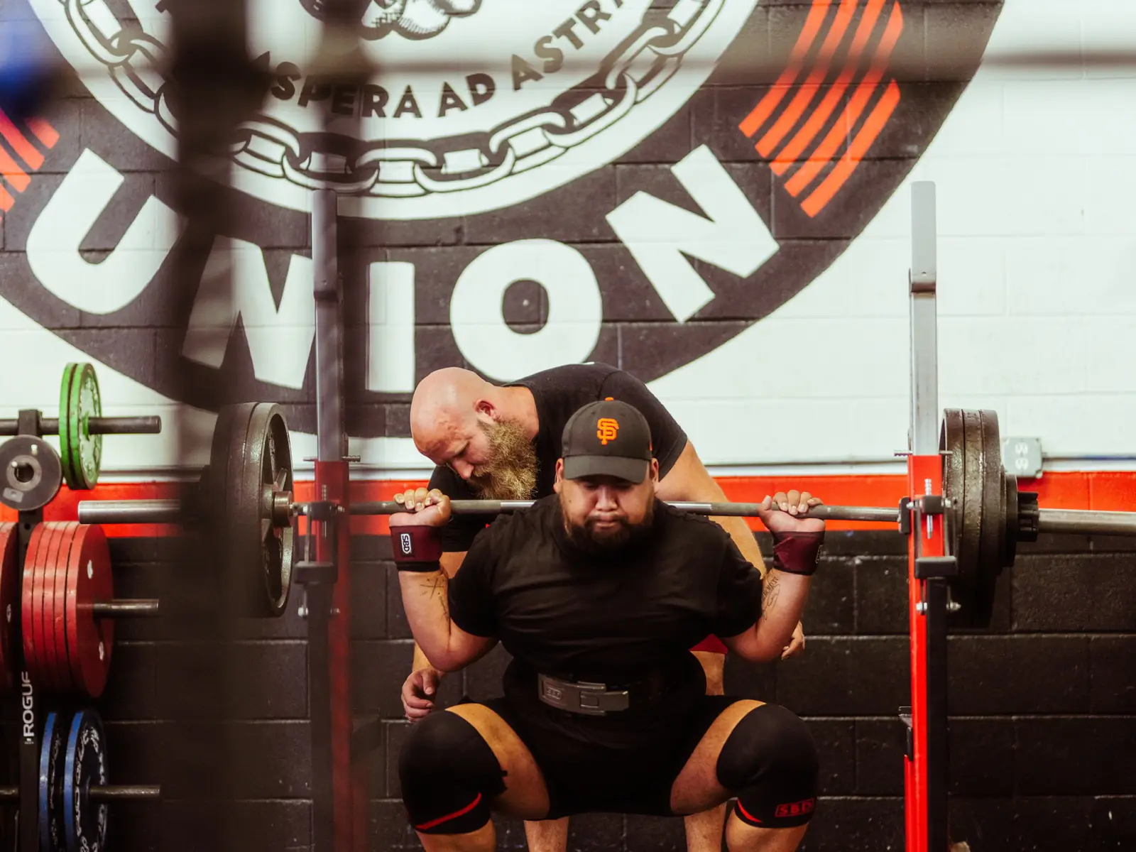 GorillaDiesel coach cueing an athlete through a loaded squat